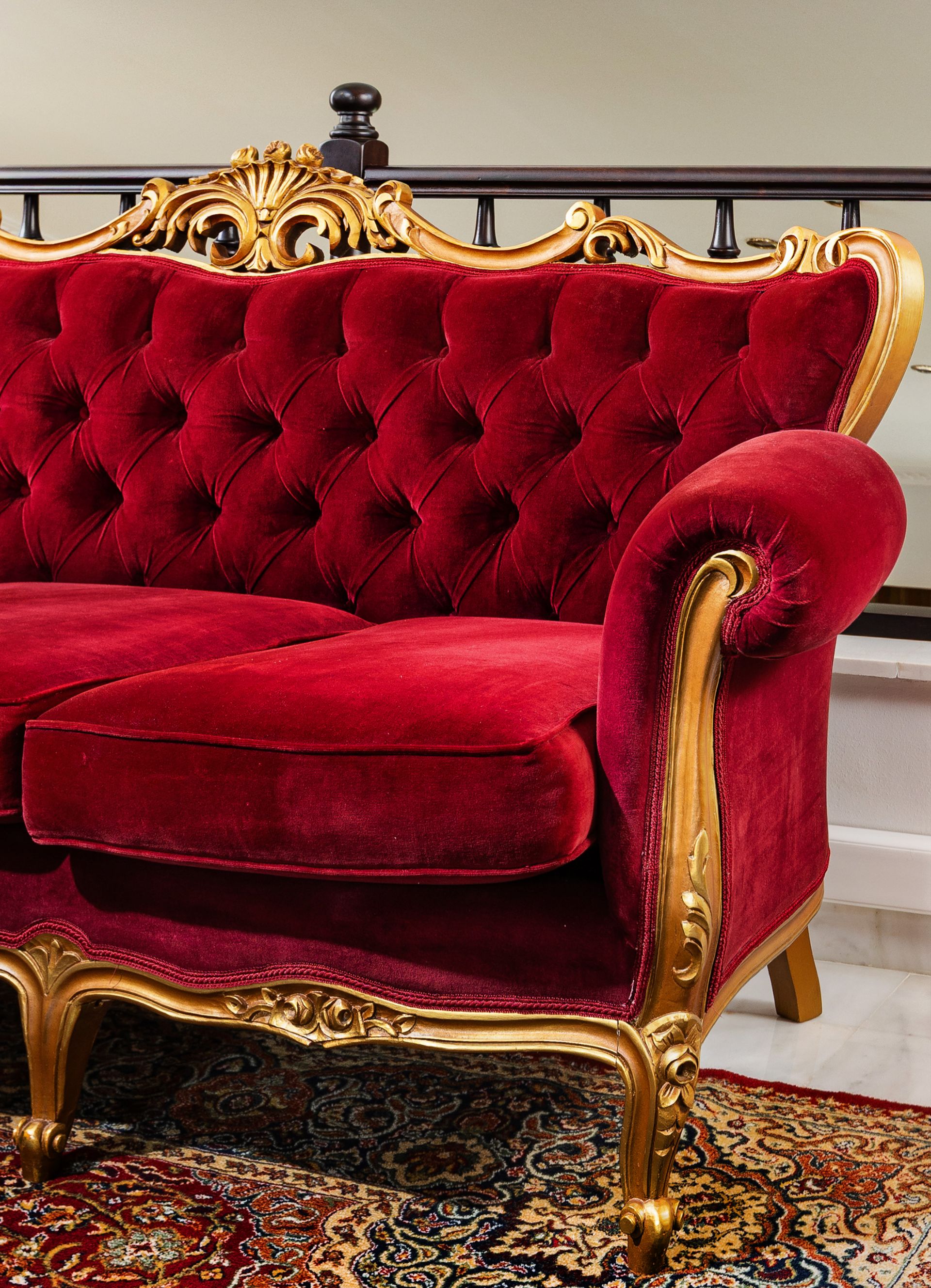 Red velvet armchair with gold carved frame, Renko Royal Villa upper-floor lounge