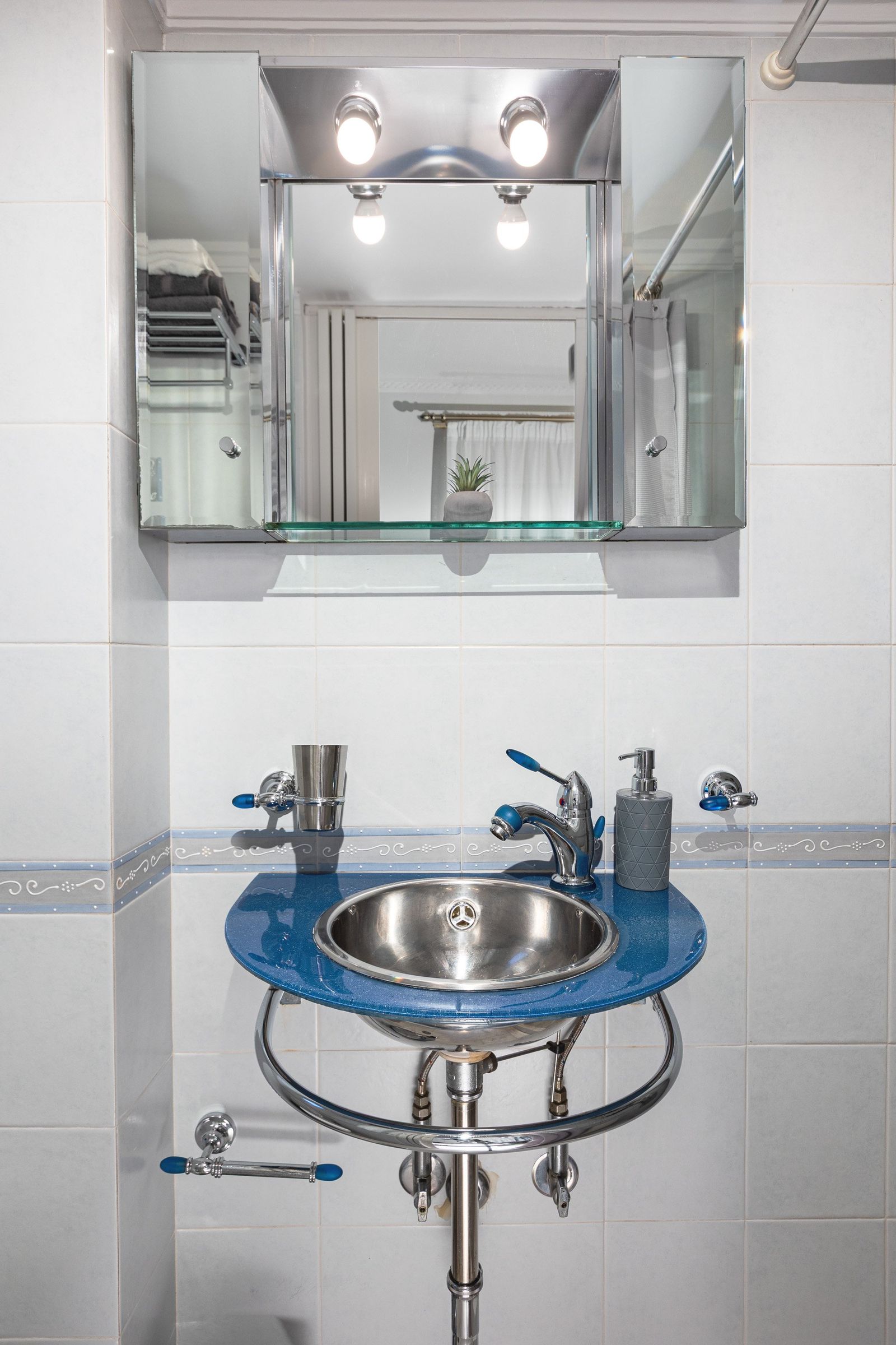 Bathroom blue steel basin chrome fixtures