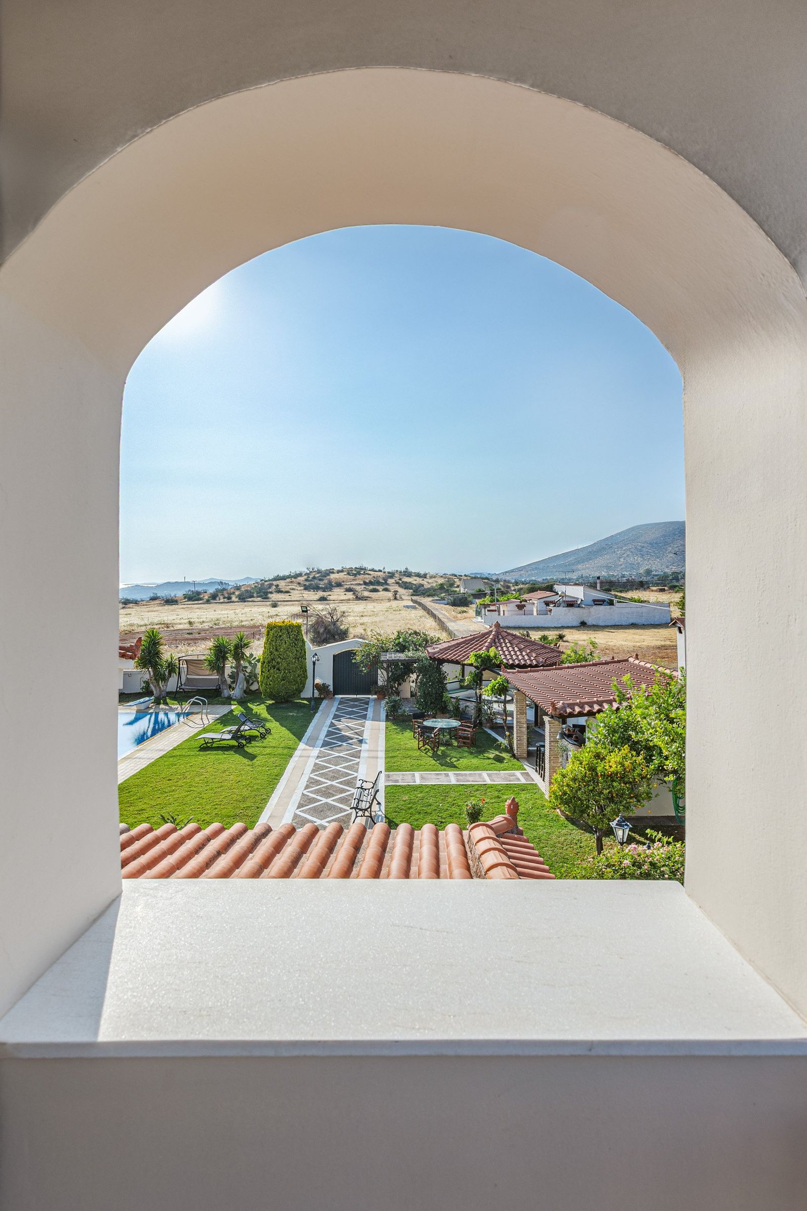 Bedroom balcony view of garden and pool