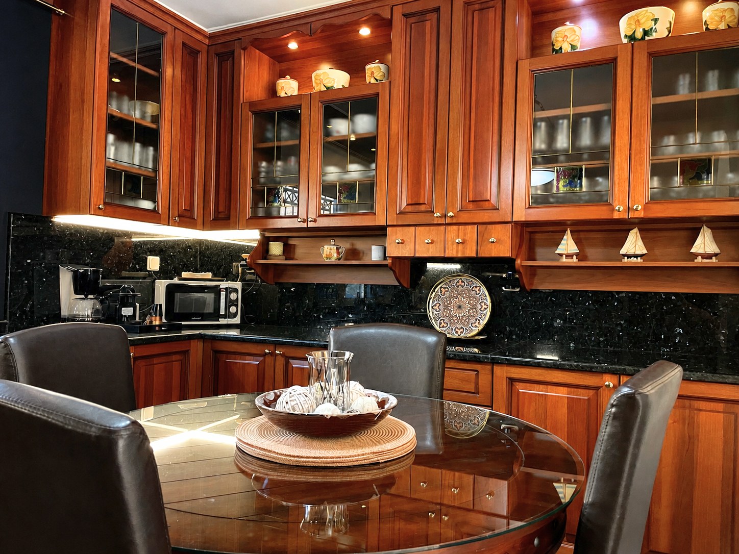 Renko Royal Villa kitchen with solid wood cabinetry and granite worktop